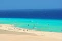 Azure sea and pale sand